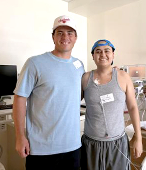 Professional football kicker, Cameron Dicker, visits with 18-year-old patient Jose Jimenz at the Jonathan Jaques Children’s Cancer Institute at Miller Children’s & Women’s Hospital. A lifelong football fan, Jose shared that his first toy as a toddler was a stuffed football.