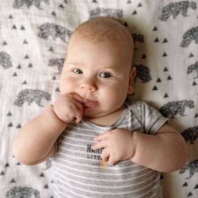 baby chewing on its finger