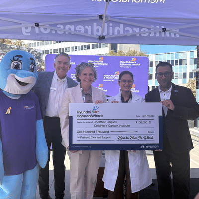 Hyundai Motor America executives present a $100,000 Impact Grant check to Bhavita Patel, M.D., hematologist/oncologist, Jonathan Jaques Children’s Cancer Institute, and Lara Khouri, chief executive officer, Miller Children’s & Women’s Hospital, in recognition of Childhood Cancer and Sickle Cell Awareness Month.
