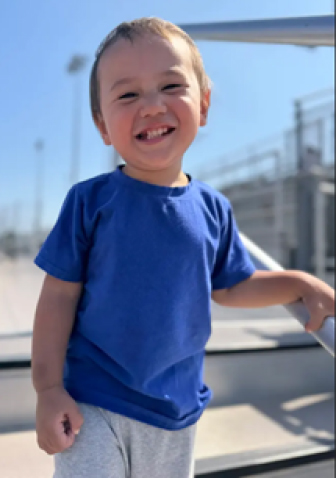 Makoa enjoying a sunny day outdoors, creating special memories beyond the hospital walls.