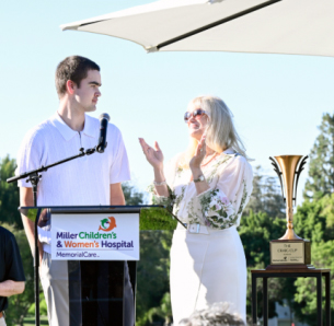 Grateful patient Sandro Apuzzo, 15, shares his recovery journey during the 16th Annual Champion’s Club Classic Golf Tournament at Virginia Country Club alongside Kimberly BeDell, M.D., medical director, Pediatric Rehabilitation, Miller Children’s & Women’s Hospital. Following a spinal cord injury more than a year ago, Sandro received extensive care through the Pediatric Rehabilitation Program at Miller Children’s & Women’s Hospital. The event helped raise funds to support rehabilitation care for children and teens facing life-changing injuries and conditions.