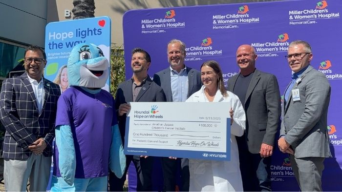 Check presentation with Hyundai executives and Miller Children's & Women's leadership.