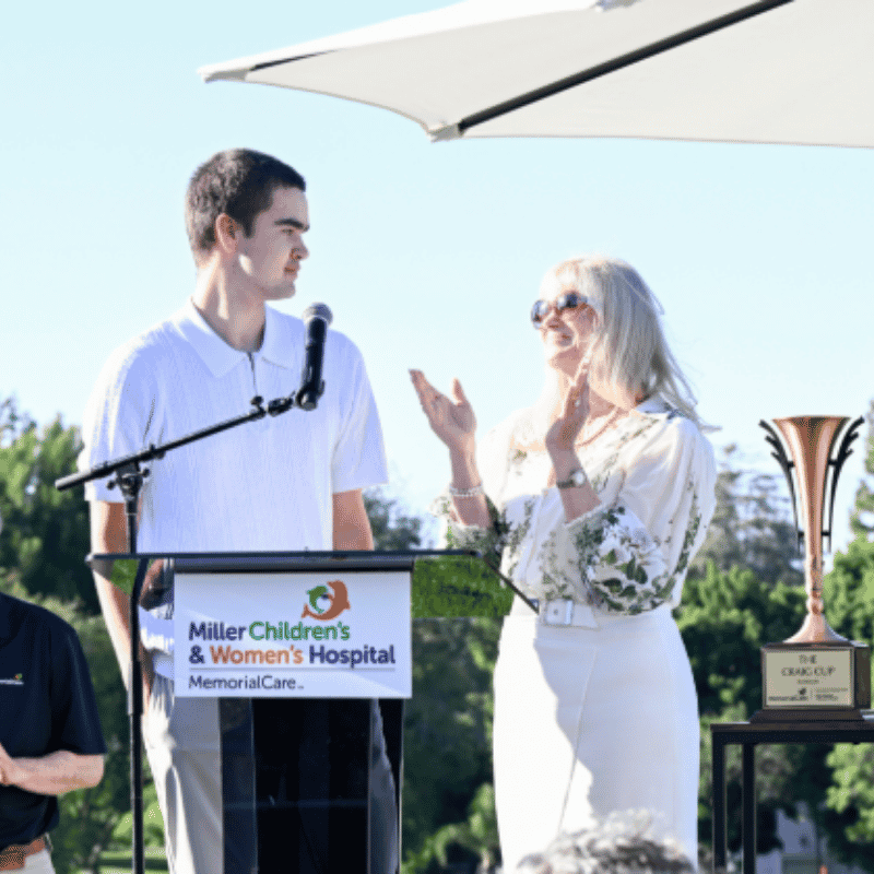 Grateful patient Sandro Apuzzo, 15, shares his recovery journey during the 16th Annual Champion’s Club Classic Golf Tournament at Virginia Country Club alongside Kimberly BeDell, M.D., medical director, Pediatric Rehabilitation, Miller Children’s & Women’s Hospital. Following a spinal cord injury more than a year ago, Sandro received extensive care through the Pediatric Rehabilitation Program at Miller Children’s & Women’s Hospital. The event helped raise funds to support rehabilitation care for children an